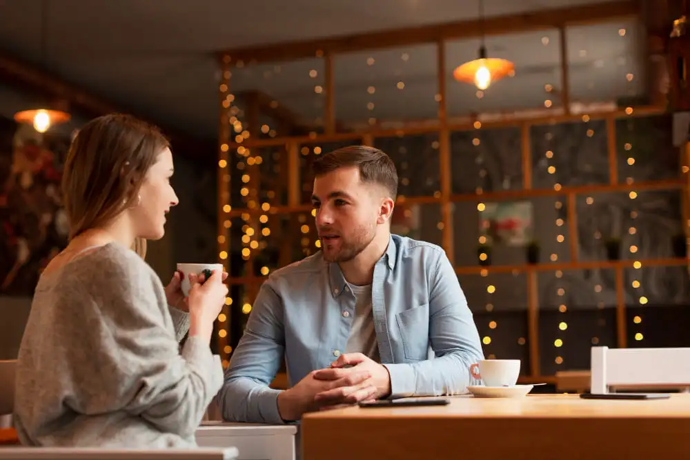 Couple enjoying a romantic dinner at a cozy restaurant - Mastering First Date