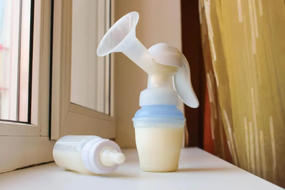 Mom using a breast pump, showcasing the benefits of breast pumping for effective milk expression.