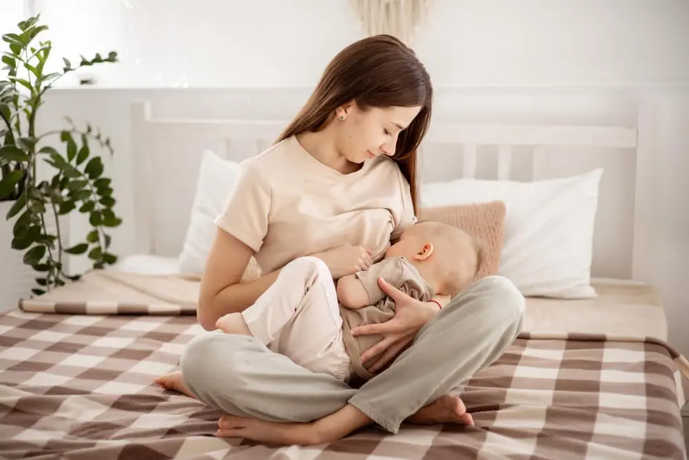 Happy mother breastfeeding her baby, showcasing the incredible benefits of breastfeeding.