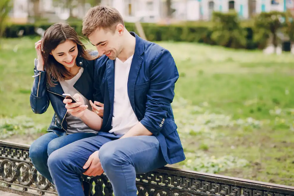 Couple managing their social media presence, illustrating the impact of social media on relationships and the importance of balance.