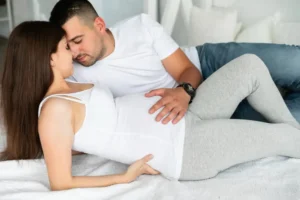 Couple practicing intimacy during pregnancy, with safety tips for sex during pregnancy