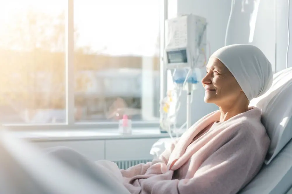 A healthcare professional administering chemotherapy to a patient, illustrating the chemotherapy process and treatment for cancer.